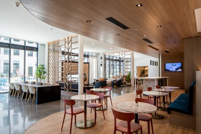 Our amenity core at Wellsmith includes a fireplace lounge, an entertainment kitchen, gaming tables and spaces to gather or work from home