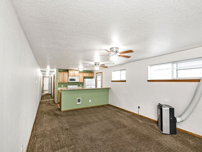 Photo - Cozy, lower level 2-bdrm/1-bath Hazelwood duplex. Portable AC, in-unit laundry, fenced side yard/... Unit SE Ash - B