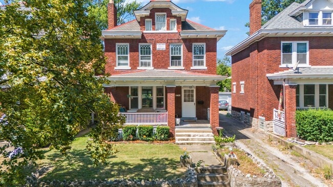 Photo - Charming 5-Bedroom Home with Exposed Brick...