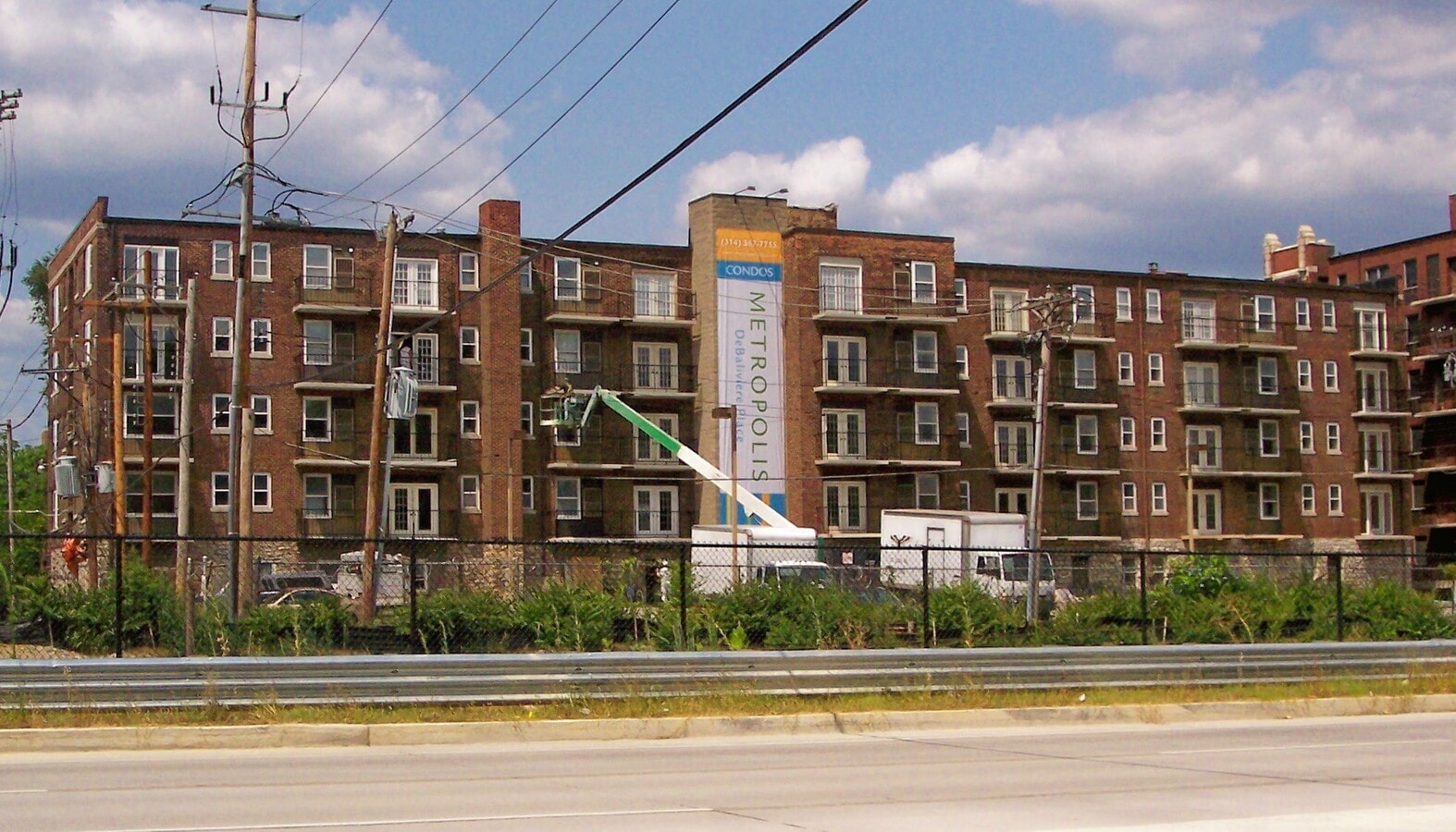 View from the south across the Forest Park Parkway - Metropolis DeBaliviere Place Apartments
