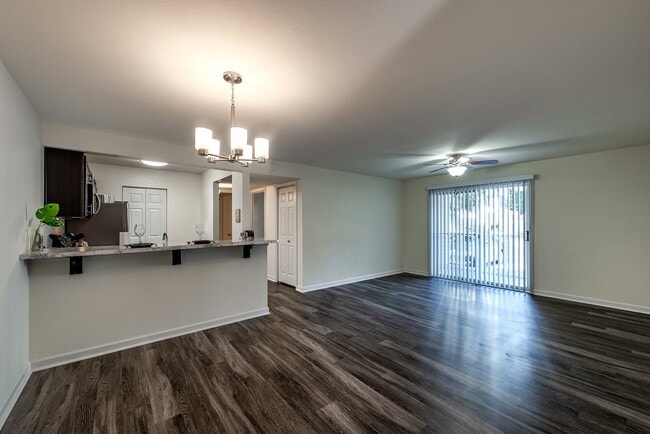 Renovated living/dining room with breakfast bar - Shadowmoss Pointe Apartments and Townhomes