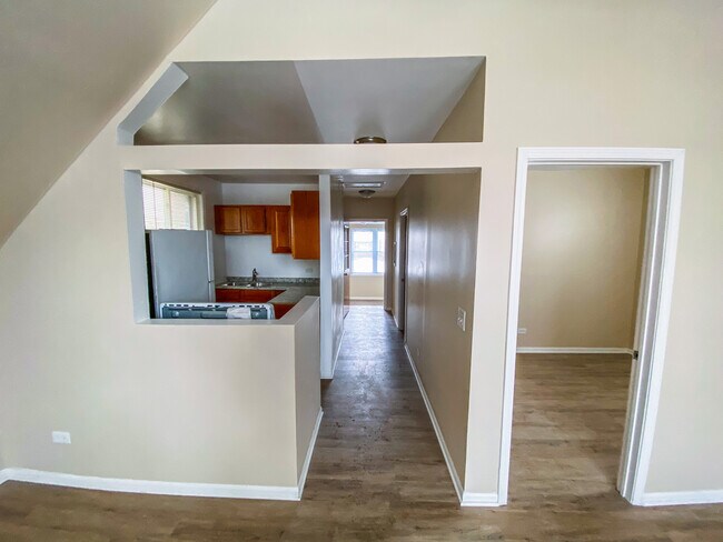 Hallway- White door frame is entrance to bedroom 1 - 2625 W Haddon Ave Unit 2
