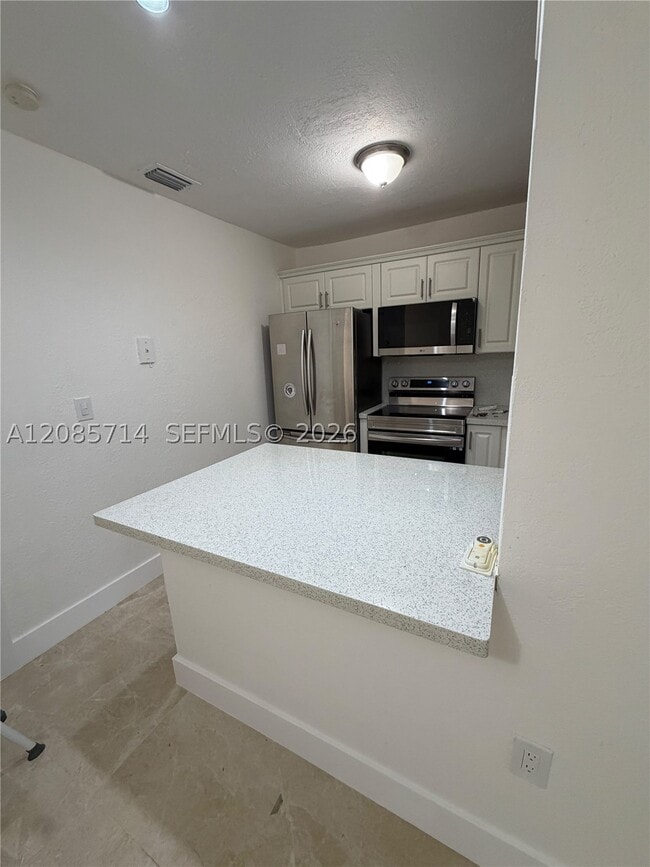 Photo - 1855 W 62nd St Unit E319