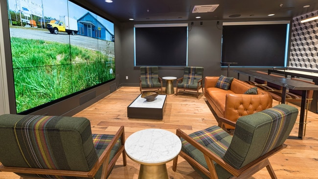 Get your game on nine screens in our gaming room - Modera South Lake Union