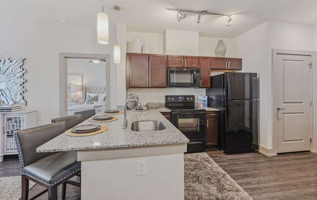Large kitchen with granite countertops and Espresso cabinets