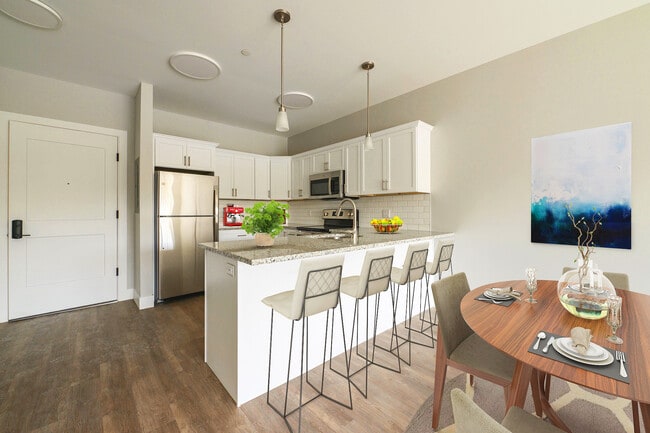 Virtually staged 1 BR unit shows dining area and counter seating. - Lakeside of Cheshire