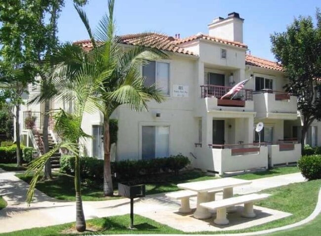 Unit 112 is located on the back side of this building - 415 Stoney Point Way Condo Unit 112