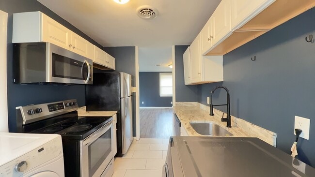Photo - Well-Maintained 3-Bedroom Home with Fenced Backyard & Assigned Parking in Central Chesapeake