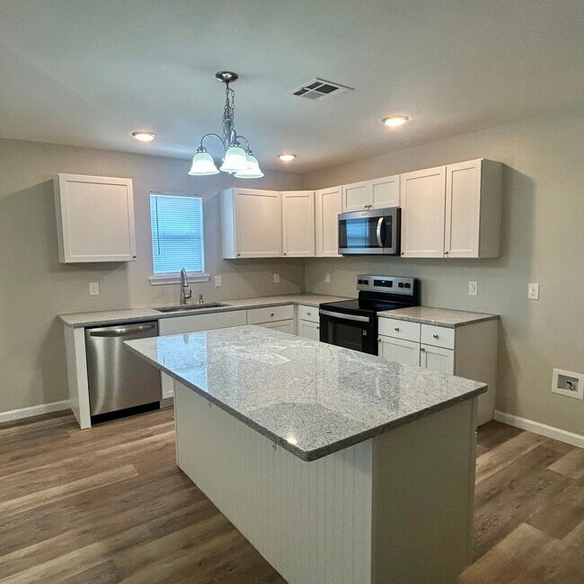 Photo - Welcome home to this beautifully designed 3-bedroom, 2 bath half duplex