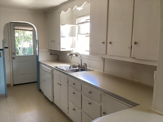 Photo - Charming 2BR Home with Spacious Yard, Detached Garage & Garden Oasis Unidad A