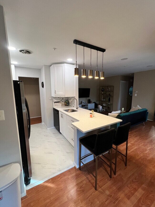 Kitchen/Living Room View - 7905 Coriander Dr Unidad #304 Rental