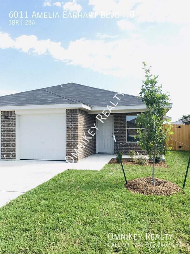 Building Photo - 6011 Amelia Earhart Blvd Unit B