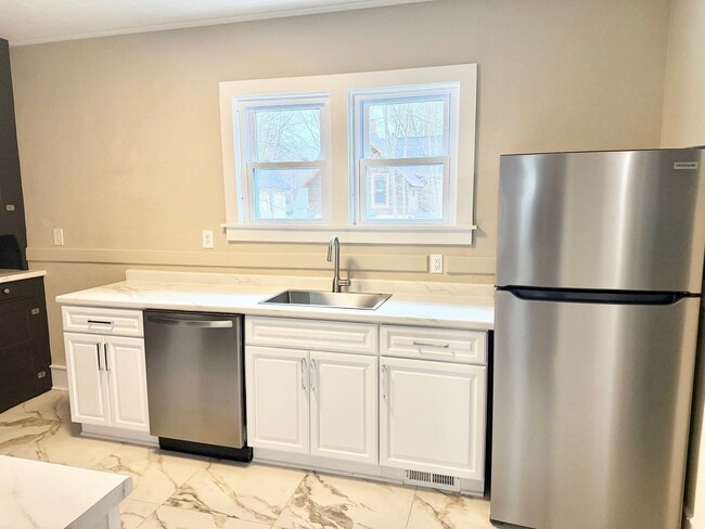 Photo - Updated 3-Bedroom Home on Tree-Lined Street with Off-Street Parking