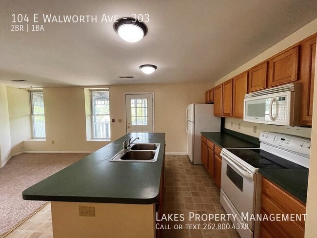 Building Photo - 104 E Walworth Ave Unit 303