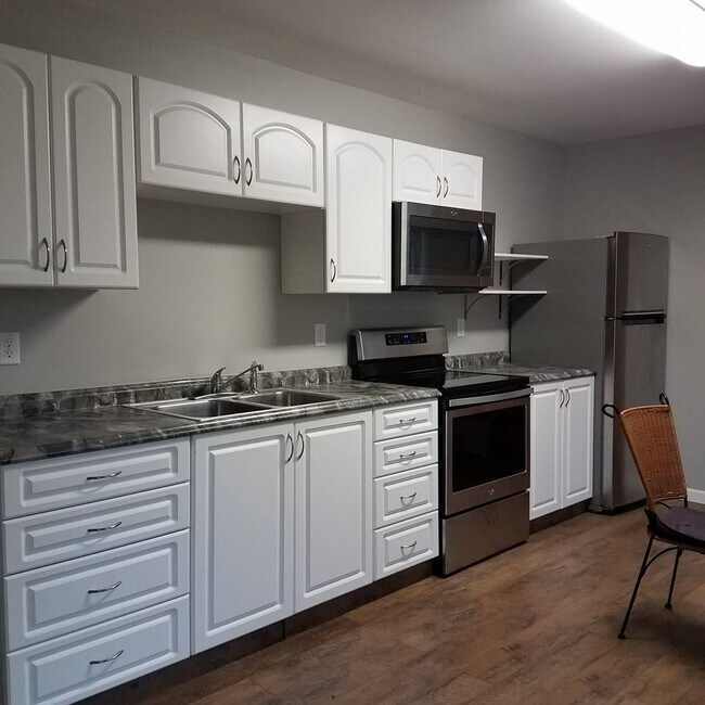 Plenty of storage. Pull out shelves with the base cabinets. Open shelving next to microwave. Sta