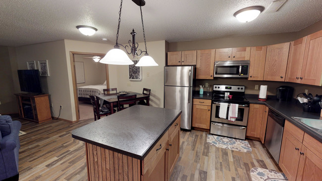 Modern Kitchens with Island &amp; Dining Area - North Pointe Apartments