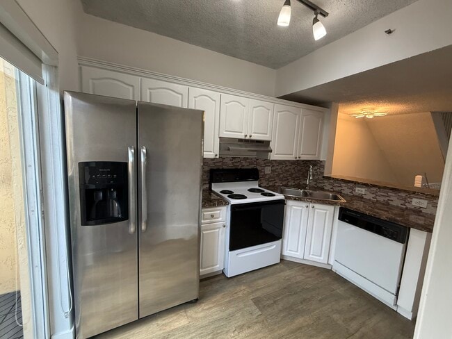 Building Photo - 7497 W 22nd Ave Unit 207