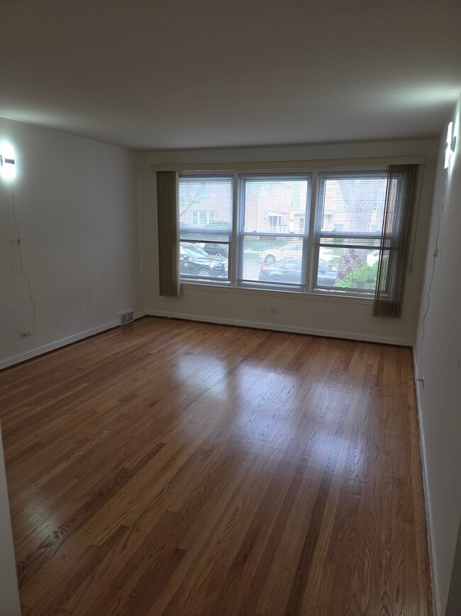 Living Room with a view of the street - 8050 Kenton Ave Unit Kenton 1N