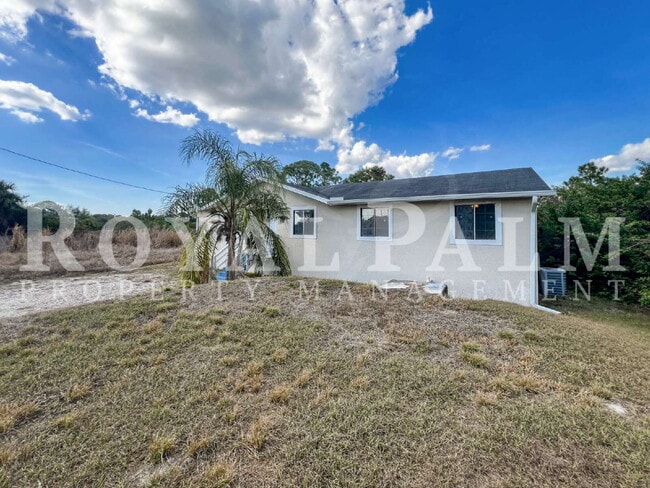 Photo - 4 Bedrooms, 2 Bathrooms & a Huge Backyard — Spacious Lehigh Acres Home with Pet-Friendly Living o...