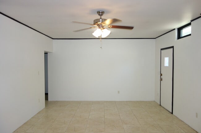 Living room view. Hallway on left