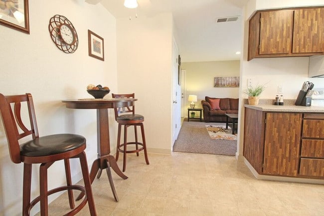 Model Unit, Dining View to Living and Entry Areas - Birdcage Village