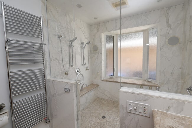 Japanese Spa Bathroom: double showers, steam room, tub, surround sound speakers and towel heater. - 4831 Canoga Ave