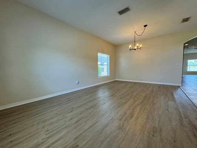 Photo - Beautiful 3/2 home near Lake Nona ~ Fenced In Yard ~ LVP & Tile Flooring ~ Community Pool!