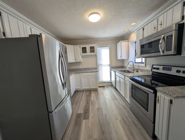 Photo - Gorgeous Brick 4 bedroom, 4 bathroom home located in the Farmwood community in Minthill!