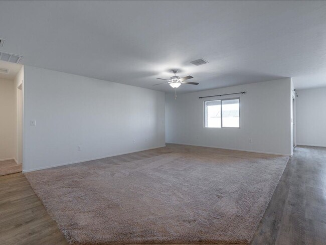 Photo - Spacious 4-Bedroom Home with Open Layout & Turf Backyard