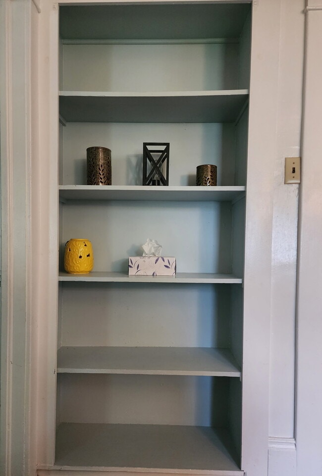 Built-in shelf in living room. - 89 S Main St Unit ApartmentA