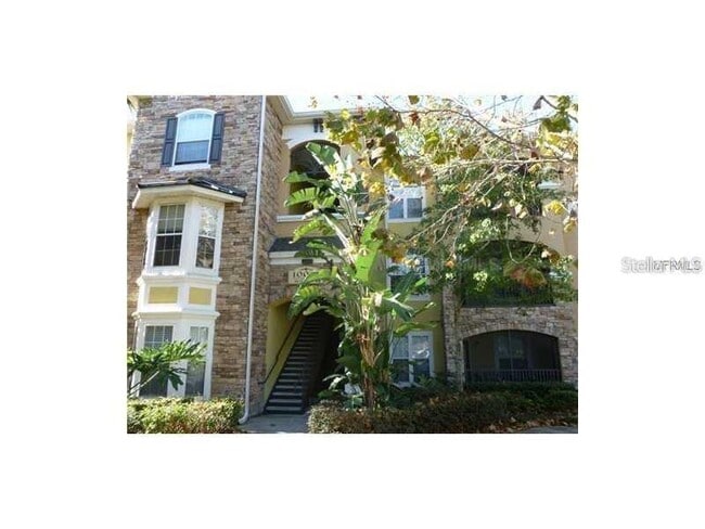 Building Photo - 10021 Courtney Palms Blvd Unit 202