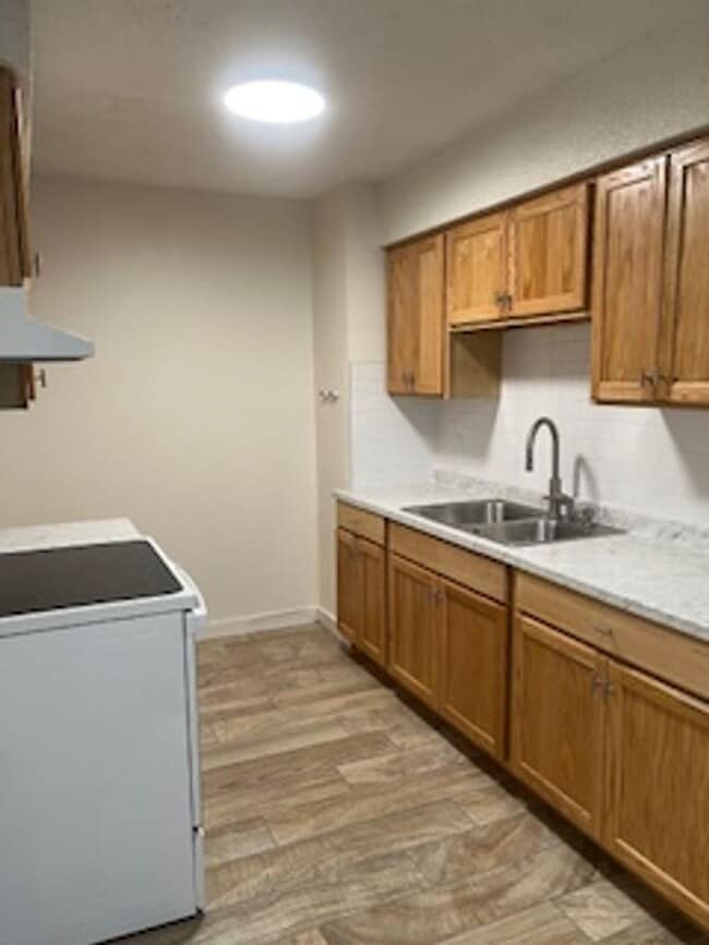 Building Photo - Newly updated with Fresh Paint/Flooring and Appliances