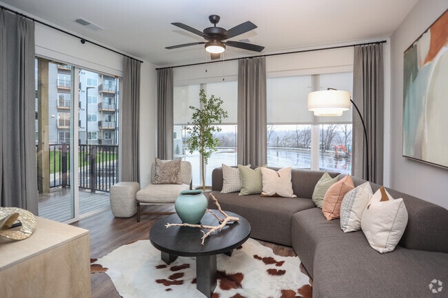 2BR, 2BA - 1,065SF - Model Living Room - Apex Newbury