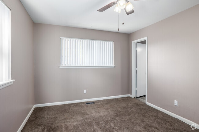 2BR, 2BA - 920SF - Primary Bedroom - Villa Gardens Apartments