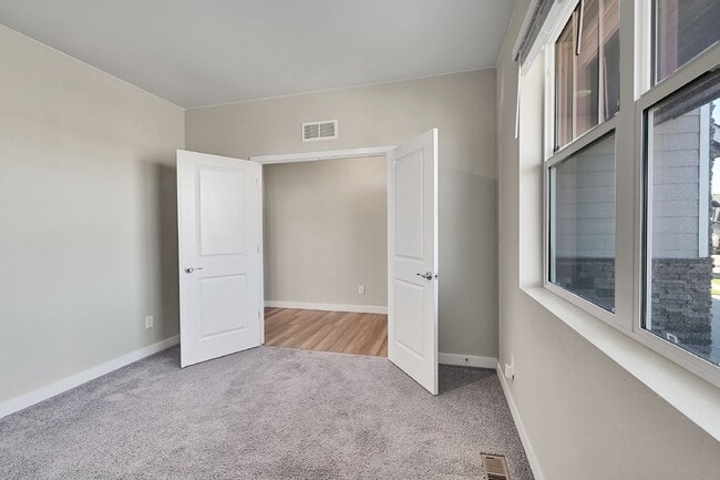 Photo - $3,340.95 - 5 Bed, 3 Bath Home in Thornton with Cozy Fireplace and Fenced-in Yard