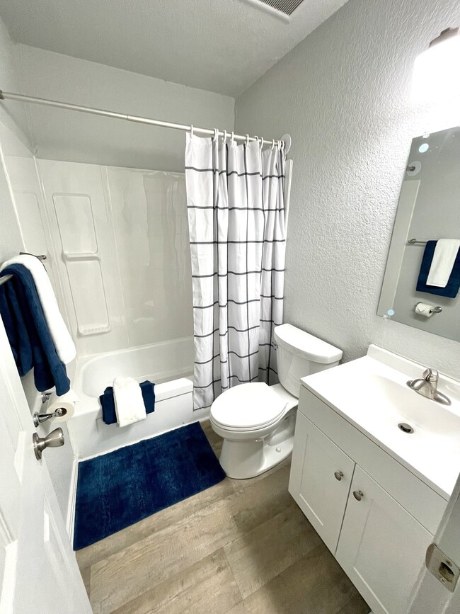 Brand New Floors, Paint, Toilet, and Vanities