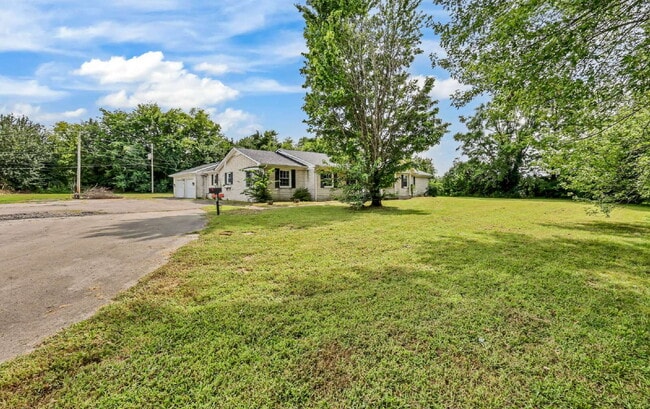 Building Photo - spacious 4-bedroom, 2.5-bath home featuring a 2-car garage and fresh updates throughout.
