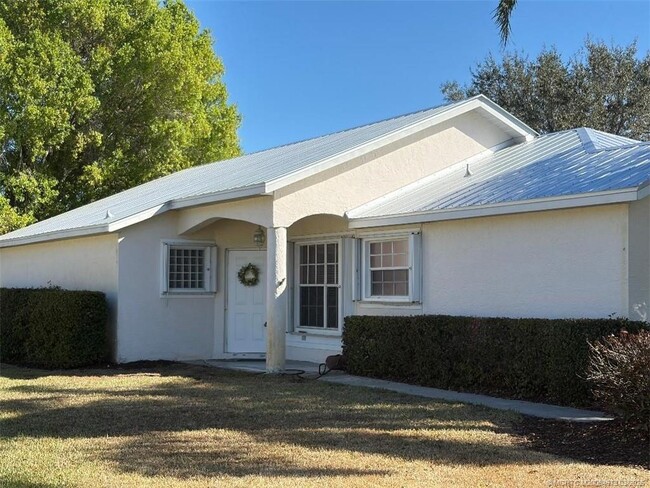 Building Photo - 3486 SW Pindo Palm Ln