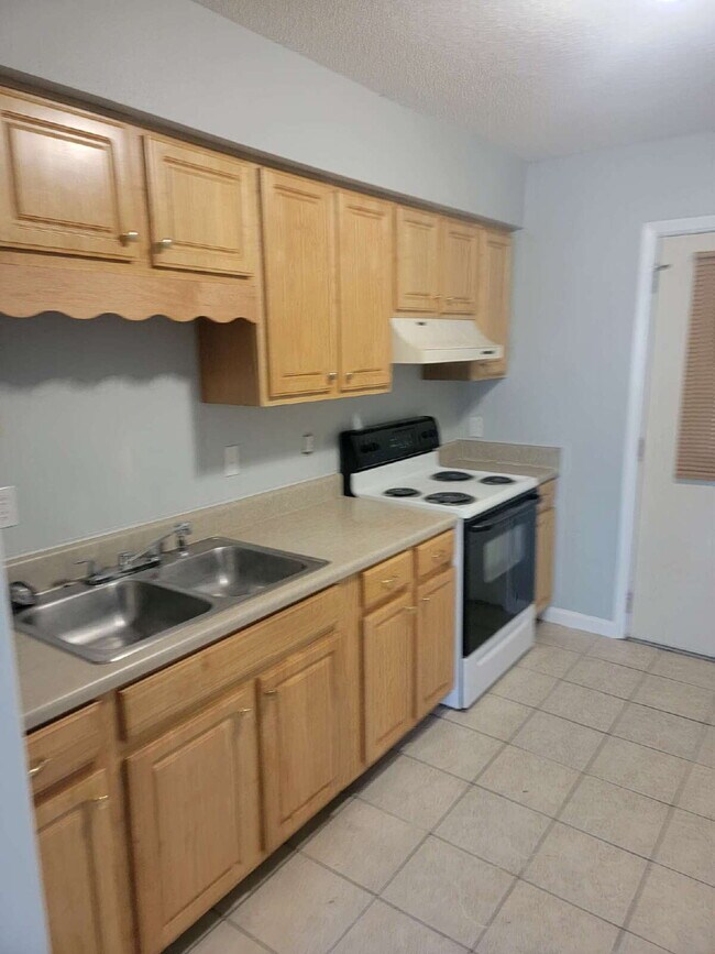 Photo - Fantastic location! This end unit offers the perfect blend of convenience and accessibility. Unit A