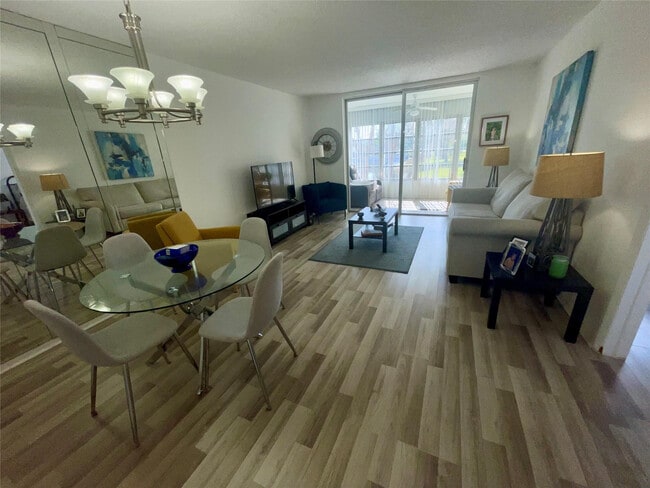 Building Photo - 5860 NW 64th Ave Unit 206