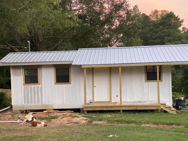 Not quite finished - Putting the last of the paint on the outside and inside - 807 Pine Street House