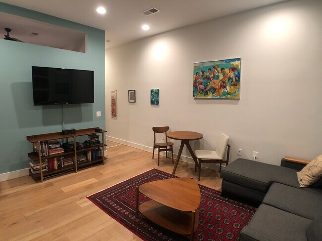 living room w/ tv - 4308 Georgia Ave NW Unit Sunny Petworth Condo