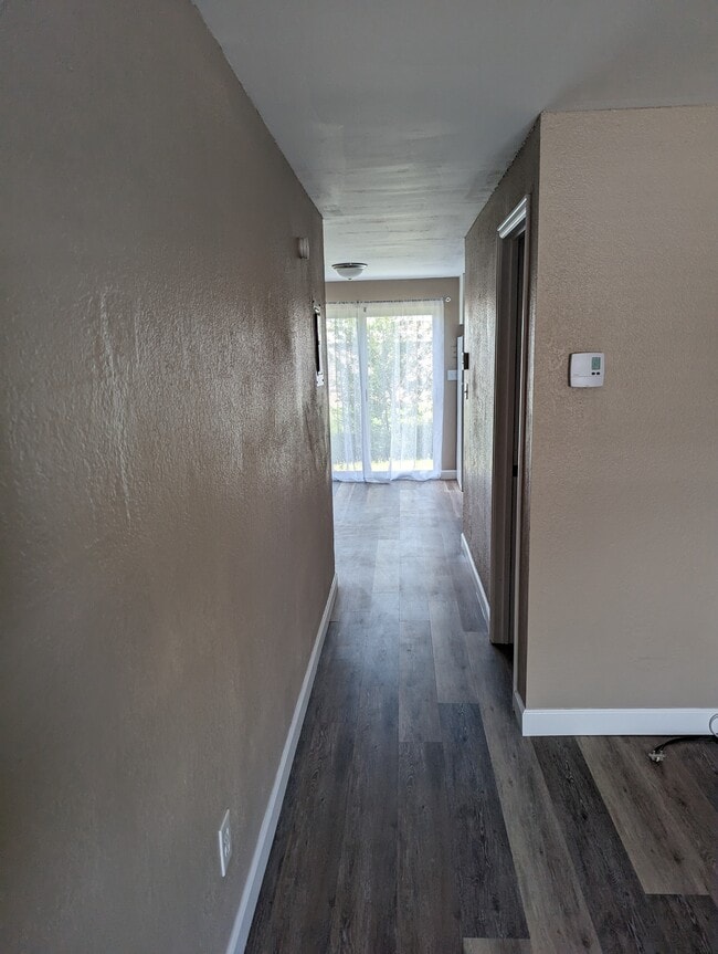 Hall to kitchen/dining - 1/2 bath to the right - 3526 Butternut Dr Unit B