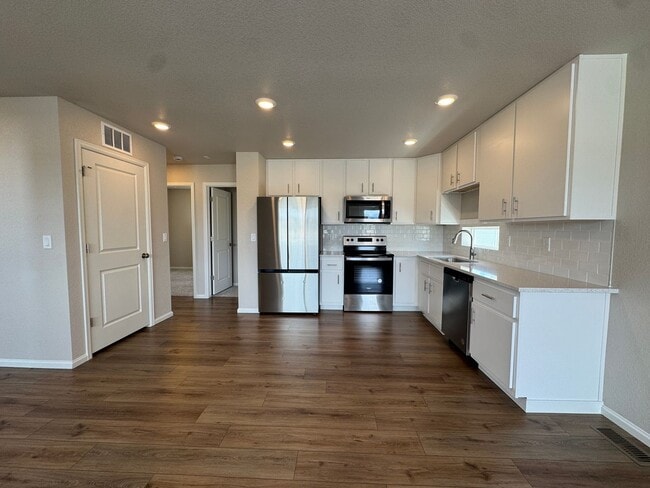 Photo - Modern 3-Level Home with Dual Balconies, Open Floor Plan & Bonus Flex Space