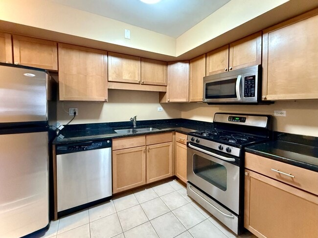 Photo - Pristine 2 Bedroom, 1 Bathroom Condo Available NOW! Heat, Water, & Parking INCLUDED in Rent! Unidad 1A