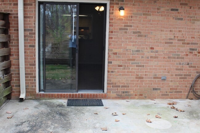 Patio on rear of condo facing Woods... - 3730 Old Flowery Branch Road Unit 2G