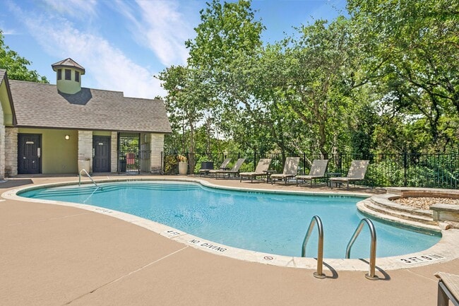 Community pool with lounge chairs