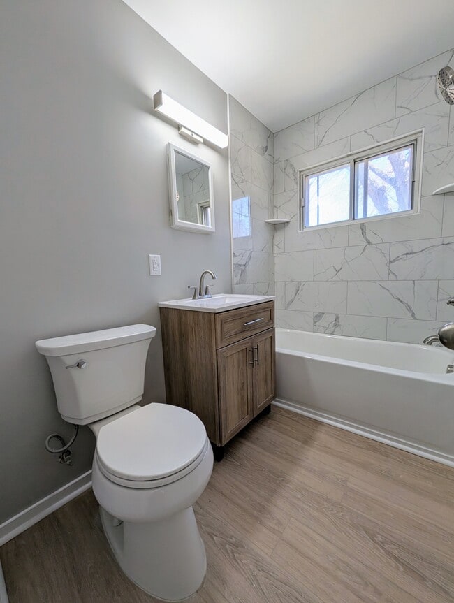 Renovated bathroom, new vanity and tile shower & tub, - 1824 Herrick Ave NE