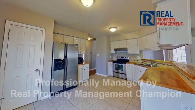 Photo - Charming home with open floor plan, vaulted ceilings and spacious backyard