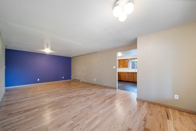 Living room empty toward kitchen